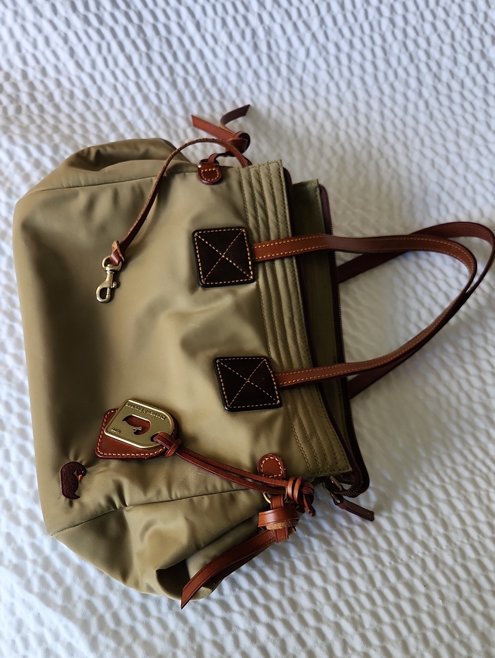 Dooney and Bourke Bag. Tan with Leather Trim And Handles